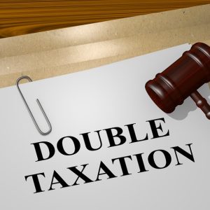 3D illustration of "DOUBLE TAXATION" title on legal document